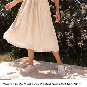 Ivory pleated Swiss dot midi skirt